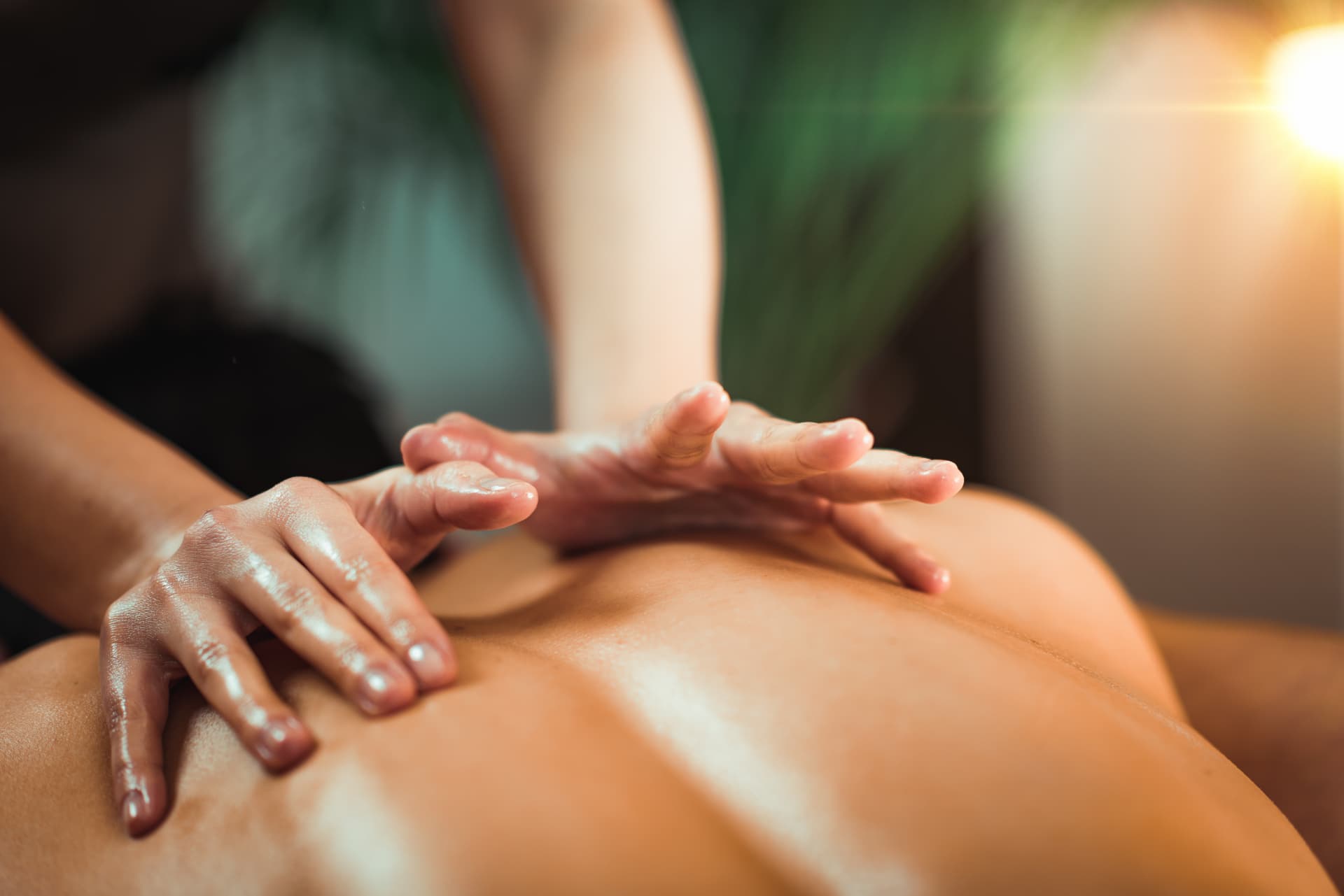 Massage therapist working on a guest’s back